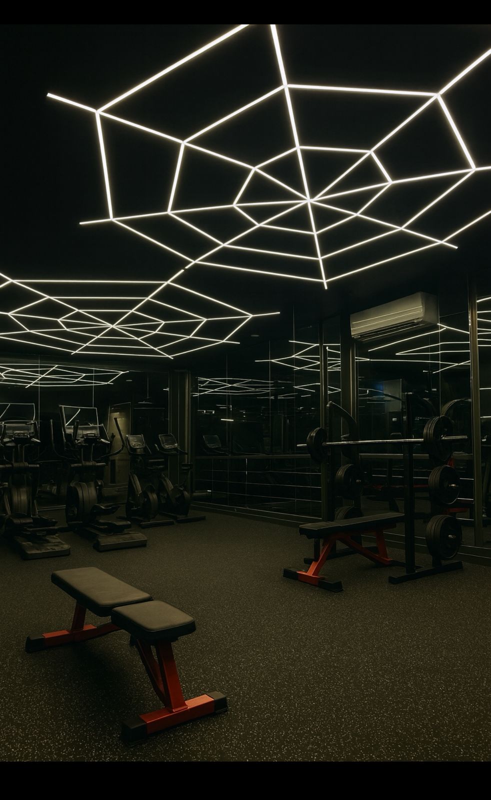 Industrial black-and-orange entrance area of the gym